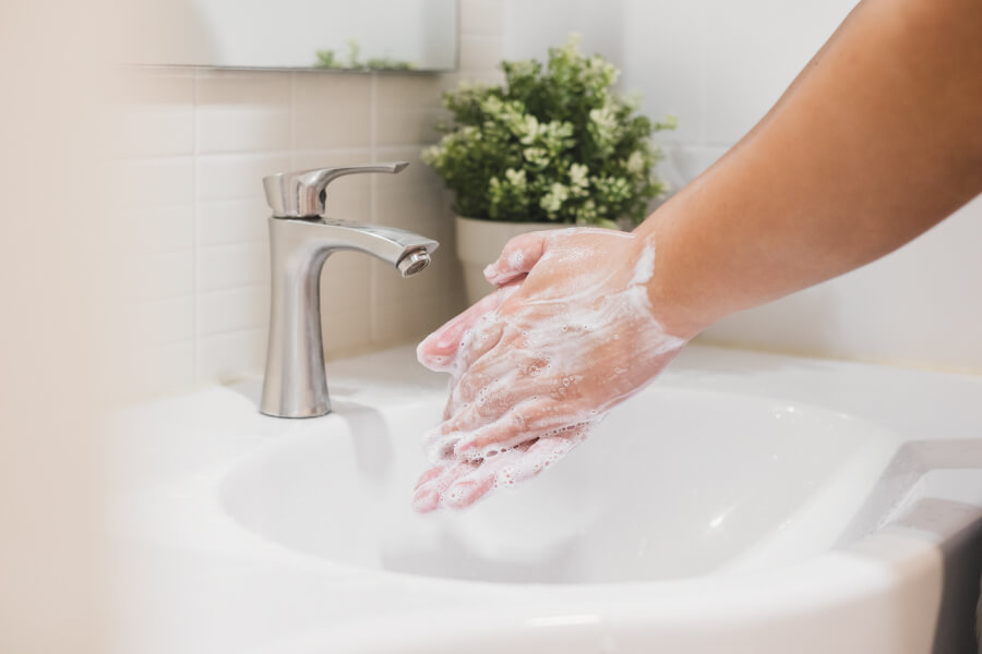 Closeup of a someone washing their hands to prevent the spread of COVID-19 in Flower Mound, TX